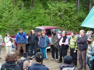 First Nation elders Xwu’p’a’lich (Barb Higgins) and Mus-swiya (Jamie Dickson) welcome everyone and speak with reverence and of the need to protect this forest, that lies on their shíshálh people's tradition lands,  for all of the community  